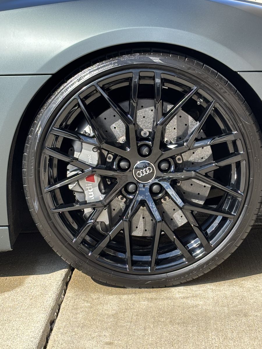 Gloss black Audi wheel and tire after cleaning and shine